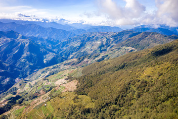 Flying drone towards beautiful amazing famous Mt. Hehuan in Taiwan over above the hilltop, aerial view shot.