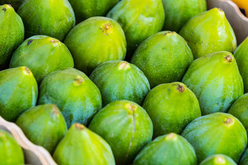 Background ripe figs without GMOs on the market in Milan, Italy.