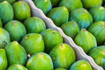 Background ripe figs without GMOs on the market in Milan, Italy.