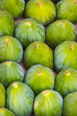 Background ripe figs without GMOs on the market in Milan, Italy.