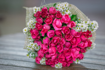 Wallpaper of flowers (roses) that are placed on chairs or wooden tables, to be displayed at festivals or on special occasions (Valentine, wedding, birthday, new year) 