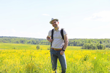 Young man travels with a backpack