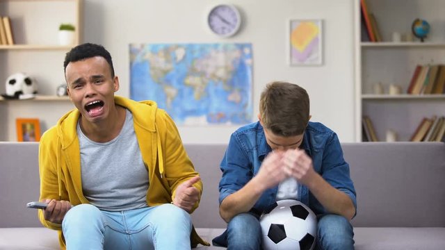 Overemotional teenagers upset with national soccer team losing game unfair judge