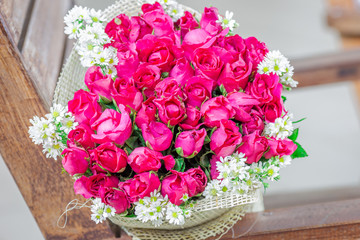 Wallpaper of flowers (roses) that are placed on chairs or wooden tables, to be displayed at festivals or on special occasions (Valentine, wedding, birthday, new year) 