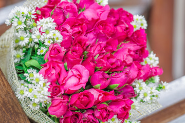 Wallpaper of flowers (roses) that are placed on chairs or wooden tables, to be displayed at festivals or on special occasions (Valentine, wedding, birthday, new year) 