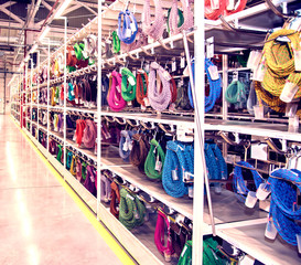 Naklejka premium Industrial landscape with stainless steel wire rope racks at a modern plant for the production of electric wiring for automobiles. Logistics