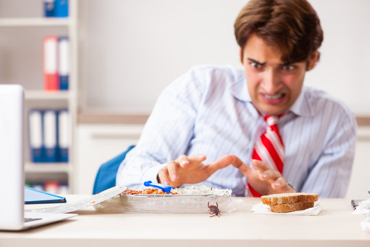 Employee Eating Food With Cockroaches Crawling Around