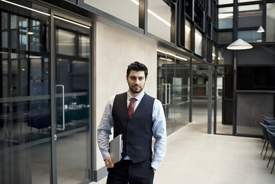 Portrait of a Middle Eastern businessman in a contemporary office