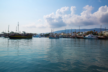 Fototapeta na wymiar Beautiful view to Kos island port in Greece. Beautiful sky and a lot of ships in harbor. 