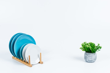 Tidy various kitchen tools and fruits or flowers on the white background.