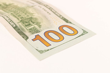 100 dollar bill. Isolated on white background. Selective focus.