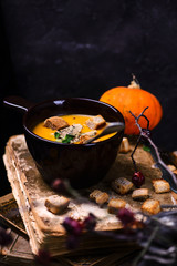 Pumpkin cream  soup with foie gras.style rustic