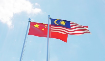 Malaysia and China, two flags waving against blue sky. 3d image