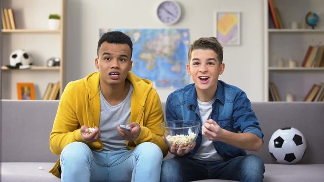 Emotional friends happy with favorite football team winning championship