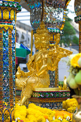 Old Sculpture of the four-faced Buddha in the Erawan Shrine sanctuary