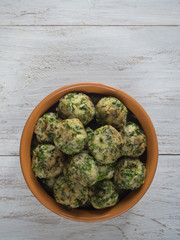 Meatballs with herbs in a clay bowl. Organic food.