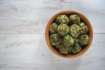 Meatballs with herbs in a clay bowl. Organic food.