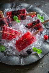 Tasty berry fruits ice cream on a stick
