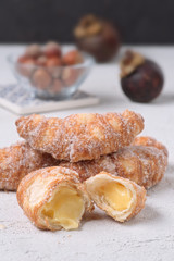 sugary stuffed croissants broken on white textured background
