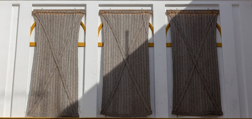 Old fashioned blinds against the sun and heat in Seville, Andalusia, Spain