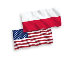 Obraz premium National vector fabric wave flags of Poland and America isolated on white background. 1 to 2 proportion.