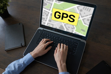GPS Global Positioning System, Worldwide navigation and tracking concept with town maps on screen.