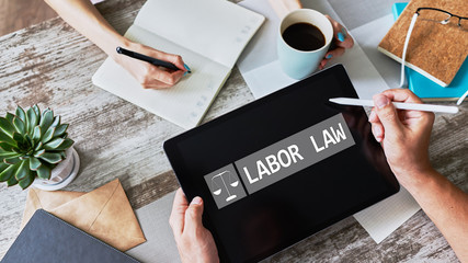 Labor law icon and text on device screen.