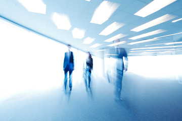 Blurred image of business people walking