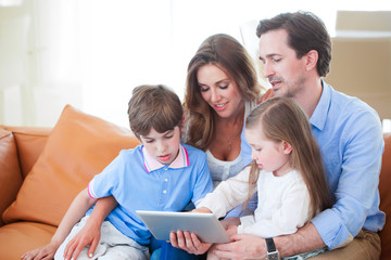 Happy family with tablet pc