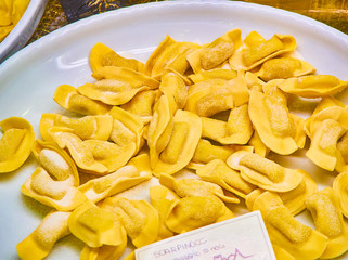 Homemade Scarpinocc Cheese and Nuts fillings for sale in a shop. Fresh stuffed pasta typical of the culinary tradition of Parre, Bergamo, Lombardy. Italy.