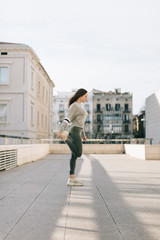 young woman doing workout in the city