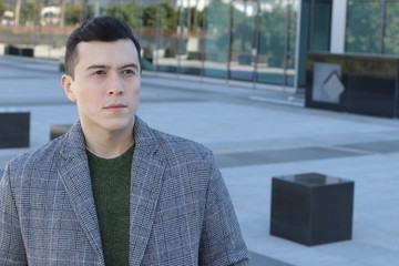 Young urban man walking on the street