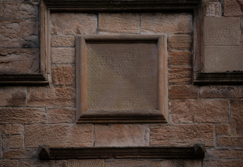 empty frame on stone wall