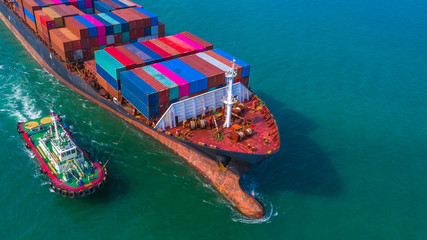 Container ship arriving in port, Tug boat and container ship going to deep sea port, logistic...