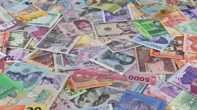 Variety world currencies notes slow rotating. World money, economy. Low angle. 4K stock video footage