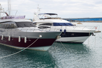 Fototapeta premium Two yachts in the port in the daytime