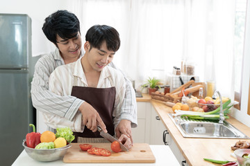Sweet gay couple preparing food