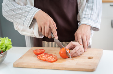 Sweet gay couple preparing food