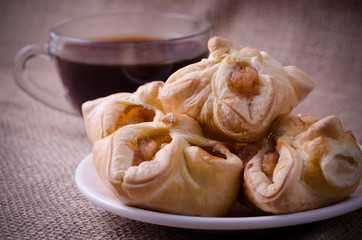Pie with apples and fruit tea on the background of burlap