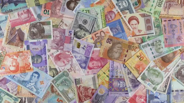 World currencies notes slow rotating. World money, economy. 4K stock video footage