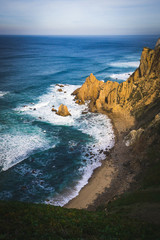 Fototapeta premium Beautiful ocean view of the Praia de Ursa, a wild place near touristic Cabo da Roca lighthouse, Portugal