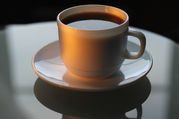 Cup of coffee on the table for Breakfast
