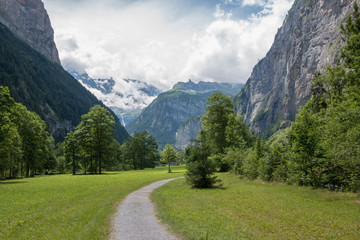 Fototapeta na wymiar View valley of waterfalls in national park of city Lauterbrunnen, Switzerland