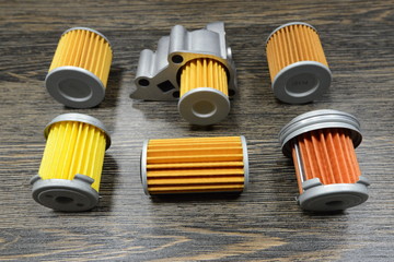 CVT transmission filters on wooden background 