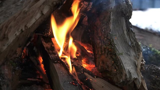 Burning Fire In The Fireplace. Slow motion. A looping clip of a fireplace with medium size flames