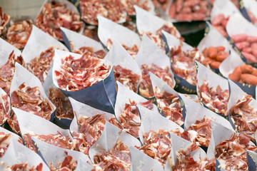 Dry Iberican Ham slices in a Market in Madrid