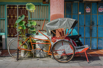 Fototapeta na wymiar Rickshaw tricycle at the street