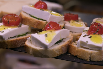 Mini sandwiches food set. Brushetta or authentic traditional spanish tapas for lunch table. Delicious snack, appetizer, antipasti in San Miguel Market, Madrid, Spain