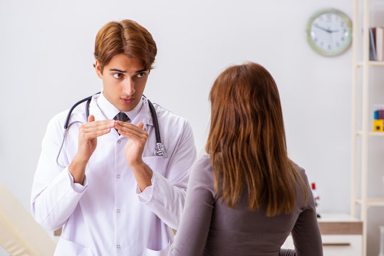 Deaf-mute Female Patient Visiting Young Male Doctor 