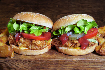 juicy beef burger, french fries, wooden board